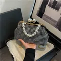 Luxury black rhinestone evening clutch bag with large pearl handle and gold chain strap - L / Black and Silver