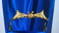 Detailed view of a golden alloy bat wing headband for Halloween vampire costumes. - Antique Gold