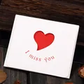Detail shot of white greeting card with heart cutout and I miss you red text print - Type 306# Heart Hollow-I miss you (With Envelope) / 10.2x8.8cm