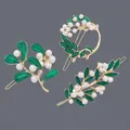 Forest style gold alloy hair clips decorated with green enamel leaves and white pearls - Pearl Leaf Hair Clips HS-J6521 (3 Pieces)