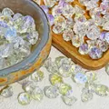 Close-up view of iridescent lotus-shaped glass beads for DIY jewelry and crafts - Lotus Pod Shape (L920) / AB Color