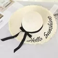 Beige straw sun hat with 'Hello Sunshine' embroidery and black ribbon bow. - M (56-58cm) / Cream