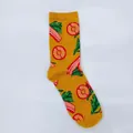 Close-up of yellow cotton crew sock featuring colorful bacon and pineapple patterns - One Size / Bacon Vegetable