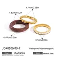 Three-piece ring set with natural stone and crystal-studded stainless steel bands in gold. - 3-Piece Ring Set (JDR0106079-7) / Gold + Brown Natural Stone