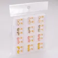 Set mit Cartoon-Tierohrsteckern mit Delfinen und Enten in einer Klarsichtverpackung - Ente / 12 Paare/Packung