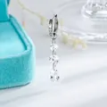 Elegant titanium huggie hoop earring featuring a dangling multi-stone crystal tassel design - White (Single Piece)