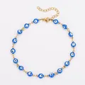 Bracelet de cheville en acier inoxydable avec perles œil bleu vif sur une chaîne dorée. - 23+5cm / Chevillère dorée - œil bleu ciel