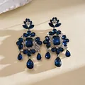 Detailed view of vintage palace style blue crystal earrings with teardrop tassels - Square Flower Tassel Earring Post Style (HE35116) / Blue