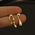 Asymmetric gold lava earrings with unique melting liquid design for a minimalist look - Gold (0112)