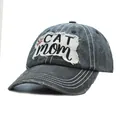 Macro view of distressed washed grey baseball cap with frayed CAT mom patch embroidery - One Size / Black