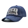 Macro view of distressed blue denim baseball cap featuring a 'CAT mom' embroidered patch - One Size / Navy Blue