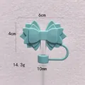 Detailed view of mint green silicone bow straw cover showing dimensions and weight - Lake Green