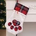Large white plaid dog paw print Christmas stocking with bone charms on a fireplace mantel - Cat Paw Style / Red Cat Paw