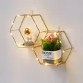 Modern hexagonal gold metal wall shelf with wood base and dimensions shown - Slanted Double Hexagon / Gold