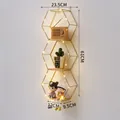 Mensola da parete esagonale color oro a 3 livelli con luci LED calde decorative - Triplo Esagono Verticale / Oro