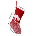 Red knitted Christmas stocking with house pattern and dimensions: 37cm x 24cm x 17cm. - Red and White Knitted Christmas Stocking - Cabin