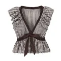 Detalle de una blusa chic de cuadros marrón con mangas de volantes y lazo decorativo delantero. - XS / Tops / Cuadros Marrones y Blancos