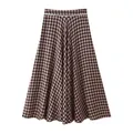 Detail of a brown and black gingham A-line maxi skirt featuring a white lace waist trim. - XS / Plaid