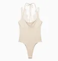 Detailed view of elegant beige halter neck bodysuit with delicate white lace trim - Light Apricot