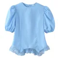 Close-up view of light blue blouse featuring puff sleeves and lace trim at the hemline - S / Tops / Sky Blue