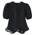 Detailed close-up view of a stylish black puff sleeve blouse featuring a delicate lace ruffled hem - S / Tops / Black