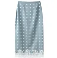 Elegant light blue polka dot midi skirt featuring intricate white lace patchwork hem detail - Blue
