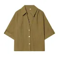 High-quality detailed view of olive green textured lapel shirt with button closure design - S / Tops / Green