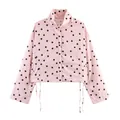 Vorderansicht einer rosa-schwarzen gepunkteten Kurzjacke mit Kordelzug am Taillensaum - XS / Oberteile / Rosa