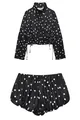 Vista detallada de un conjunto elegante de lunares negros y blancos con top y shorts. - XS / Top Y Pantalón / Negro