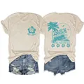 Detailed view of the teal beach graphics printed on the front and back of a beige T-shirt - S / Tops / Sand