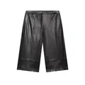 Vue de face d'une jupe-culotte noire en similicuir à jambes larges et coutures - XS / Bas / Noir