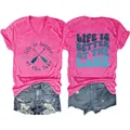 Close-up of hot pink V-neck T-shirt with 'life is better at the lake' print and oars - Rose Red