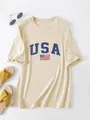 Casual women's oversized beige T-shirt featuring USA flag print and blue lettering - S / Tops / Sand