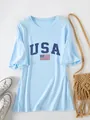Detailed view of the USA flag print on a casual light blue oversized short sleeve T-shirt - S / Tops / Light Blue