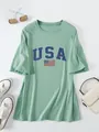 Close-up view of the USA flag graphic print on this loose sage green ruffled sleeve T-shirt - Light Green