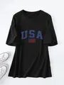Oversized black T-shirt featuring a blue USA graphic and American flag print. - Black