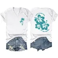 Detail of white V-neck T-shirt with 'Life Is Better at the Beach' hibiscus graphic - S / Tops / White