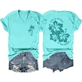 Detailed view of the turquoise V-neck t-shirt showing front and back print designs. - S / Tops / Deep Water Blue