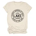 Detailed macro view of the What Happens At The Lake slogan print on a soft beige cotton t-shirt - S / Tops / Sand