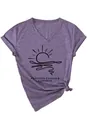 Close-up detail of 'Forever Chasing Sunsets' graphic on a purple V-neck cotton T-shirt - Purple (Black Font)