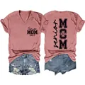 Detail view of Senior Mom 2027 V-neck t-shirt and distressed denim shorts outfit - Rose Gold (Black Font)