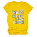 Detailed view of yellow crew neck T-shirt featuring 'I Closed My Book To Be Here' print - S / Tops / Yellow