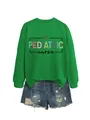 Felpa verde da infermiera pediatrica con scritte colorate e pantaloncini di jeans. - Taglia S / Top / Verde erba (Grafica nera)