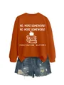 Detailed shot of an orange sweatshirt with homework print paired with denim shorts - Rust Orange (White Graphic)