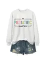 Detailed view of the grey pediatric nurse crewneck sweatshirt with colorful print - S / Tops / Off-White (Black Graphic)