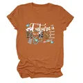 Vue détaillée de l'imprimé 'Future Nurse' sur un t-shirt orange à manches courtes. - S / Hauts / Orange Brûlé (Texte Blanc)