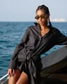 Fashionable black long sleeve shirt dress with tie-waist detail worn by model on yacht - S / Top And Bottom / Black