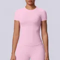 Maglietta da yoga rosa senza cuciture per donna, tessuto elasticizzato e traspirante sport. - Taglia S / Top / rosa Barbie