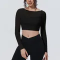 Detailed view of black faux two-piece mesh yoga top with long sleeves and breathable fabric - S / Tops / Black