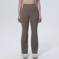 Detailed view of high-waisted breathable flare yoga pants with slim fit silhouette - S / Bottoms / Khaki Brown
